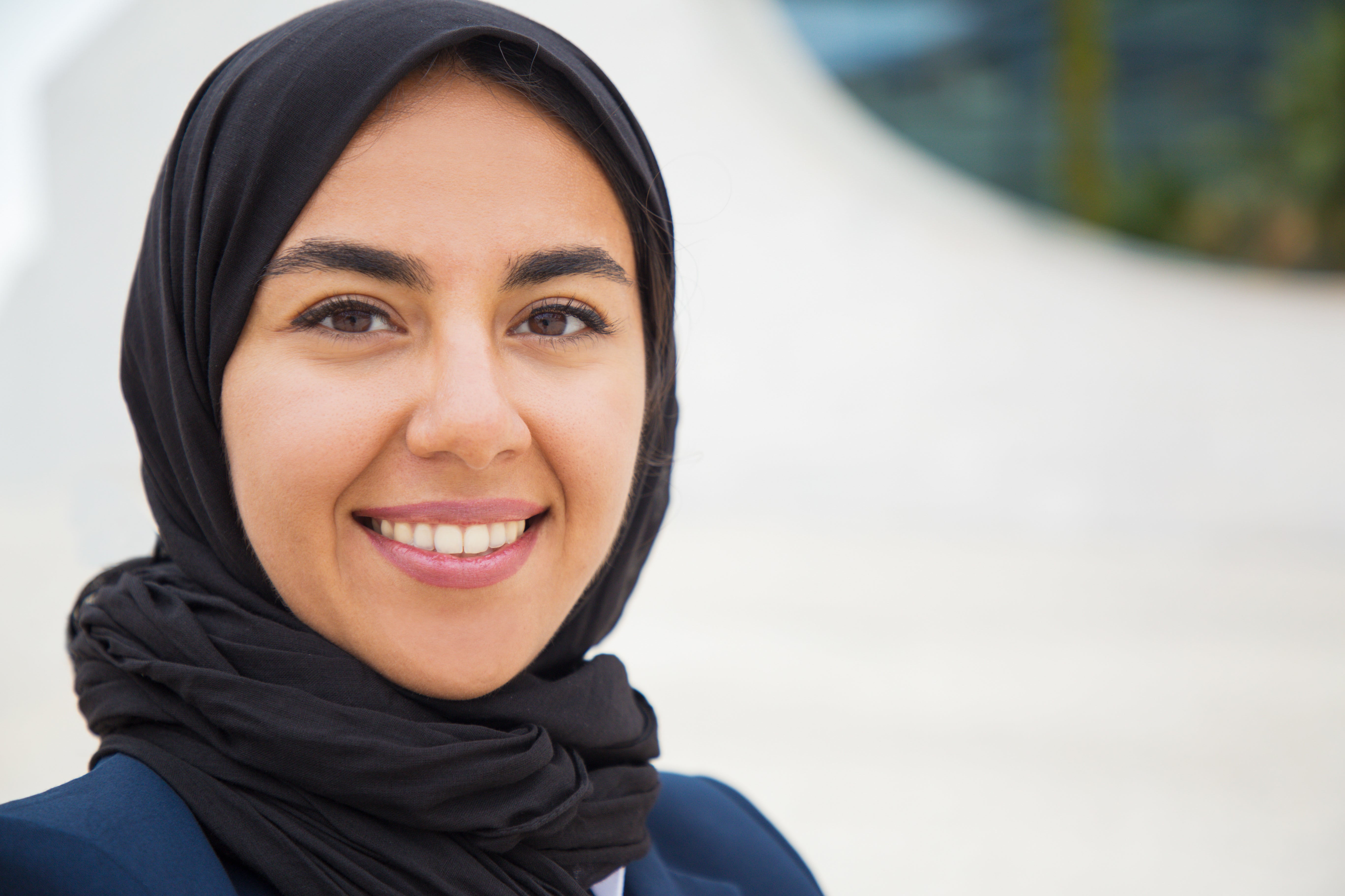 files/happy-confident-muslim-business-lady-posing-outside.jpg