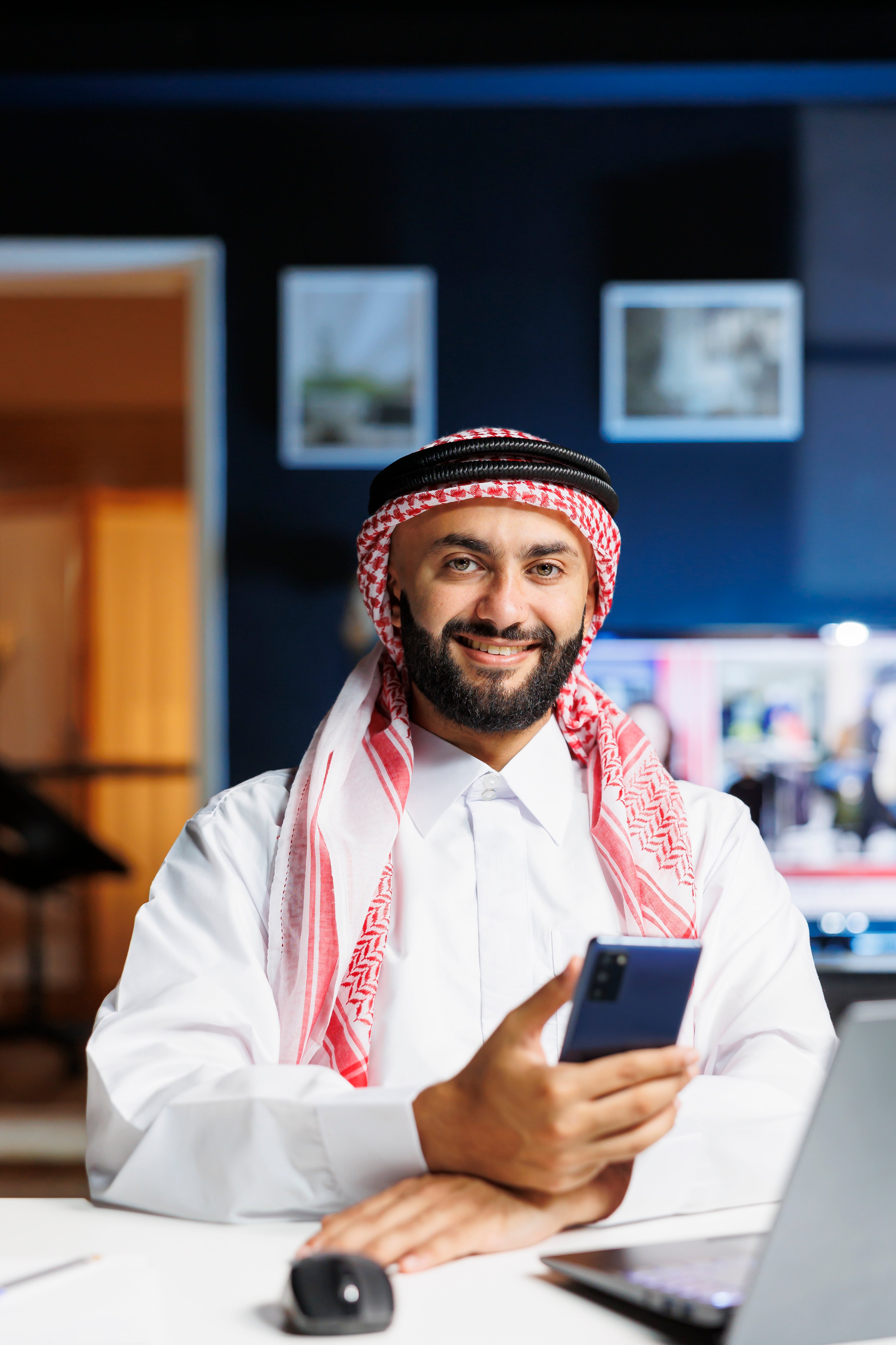 files/smiling-muslim-guy-holding-cell-phone.jpg